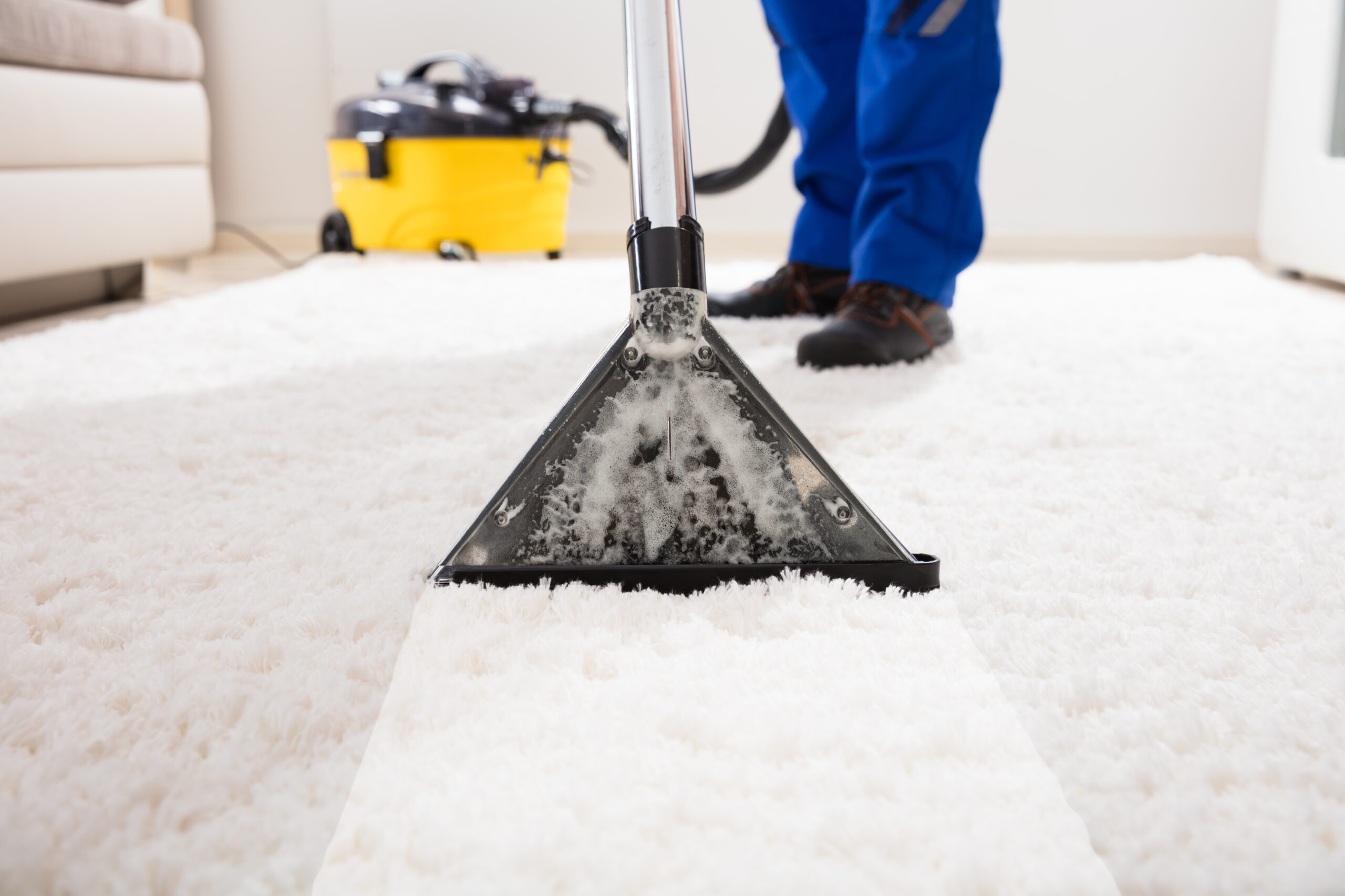 Close up,Of,A,Janitor,Cleaning,Carpet,With,Vacuum,Cleaner,At