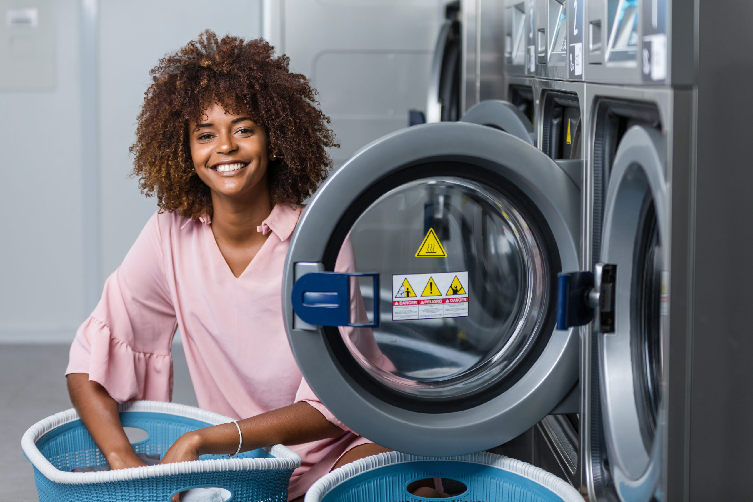 Young,Black,African,American,Woman,Washing,Her,Clothes,In,A